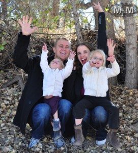 family-of-4-hands-in-the-air